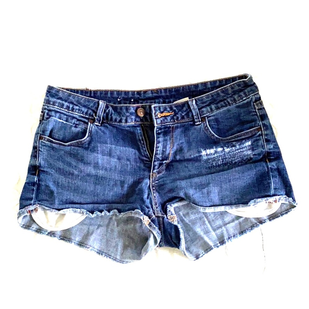 Gently worn distressed jean shorts.